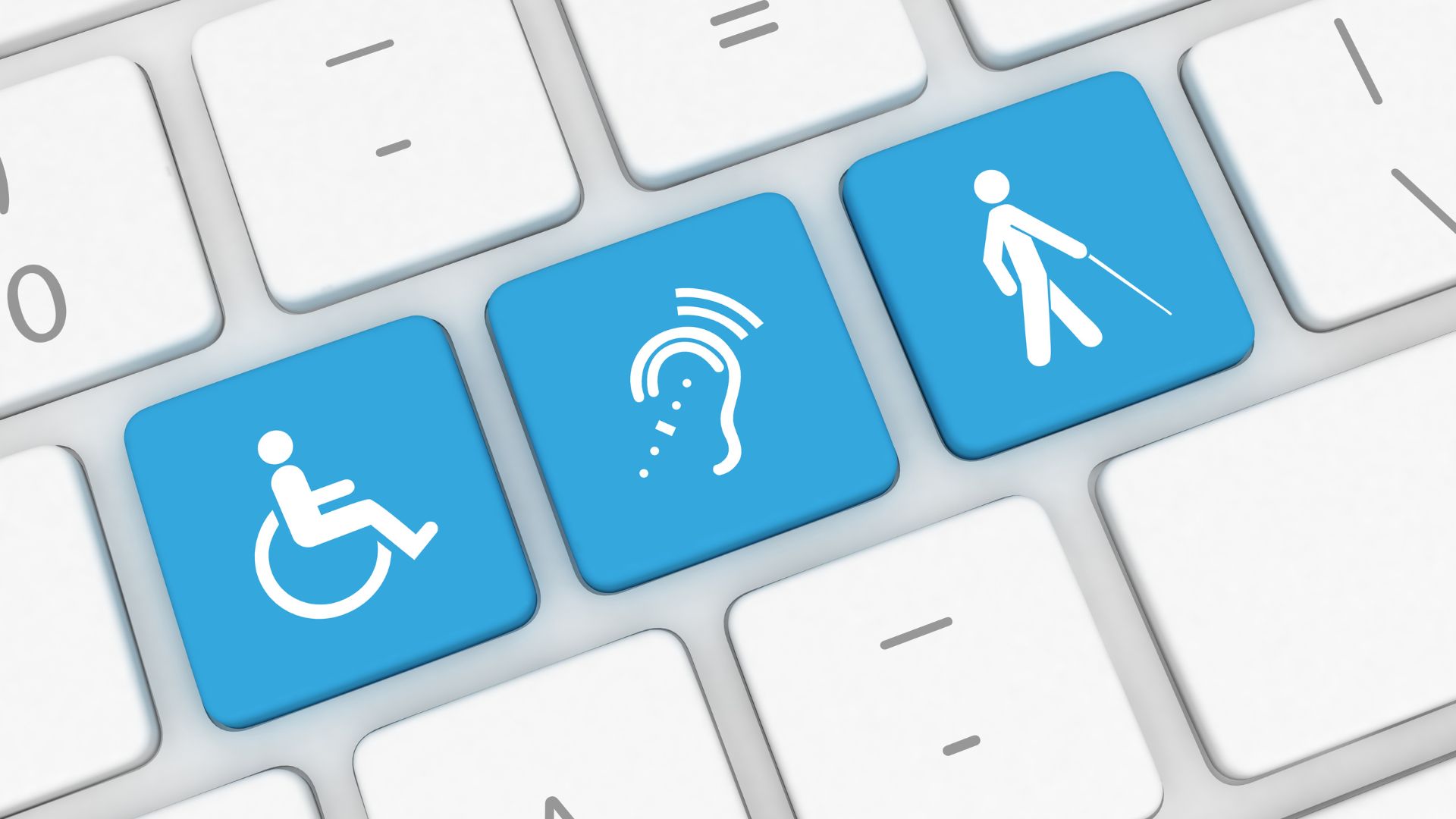 Three blue keyboard keys with a wheelchair, an ear with sound waves and a person with a white cane symbol on each.